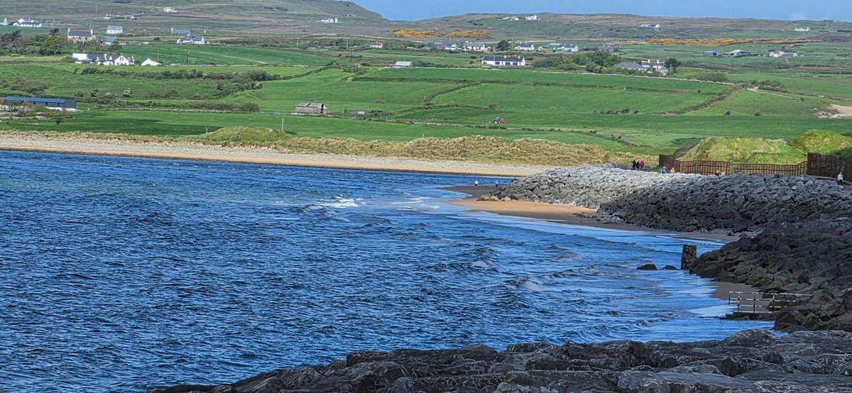 tiny wave at the north end of the beach as the tide is backing off the rocks